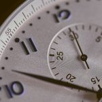 a close up of a silver watch face